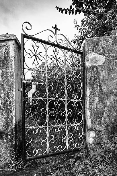 istock Old metal fence gate with cross 623072048