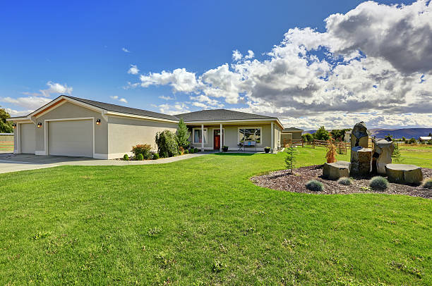 istock American luxury concrete house with spacious front yard. 623087514