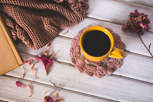 istock Coffee cup and open book close up. Winter and Christmas 623088452