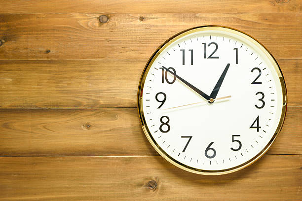 istock wall clock on the wooden wall 623088594