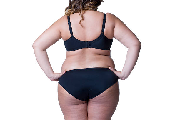 corpo femminile in sovrappeso, donna grassa con cellulite isolata su bianco - fulness foto e immagini stock