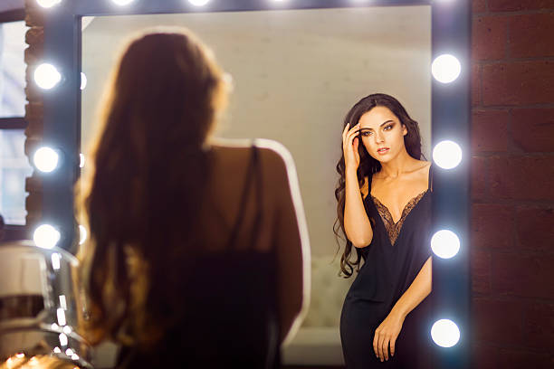 istock Young woman posing near the mirror 623089932