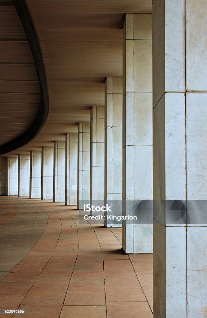 Marble colonnade The marble colonnade of plurality of columns arranged in a semicircle Architectural Column Stock Photo