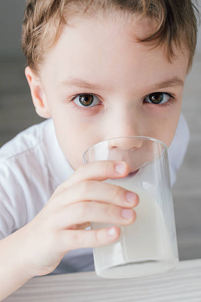 istock The child drinks milk from a glass 623094354