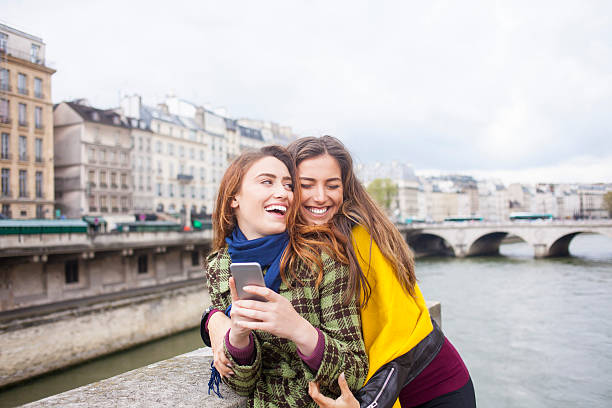 istock Cheerful young women having fun on a bridge 623095496