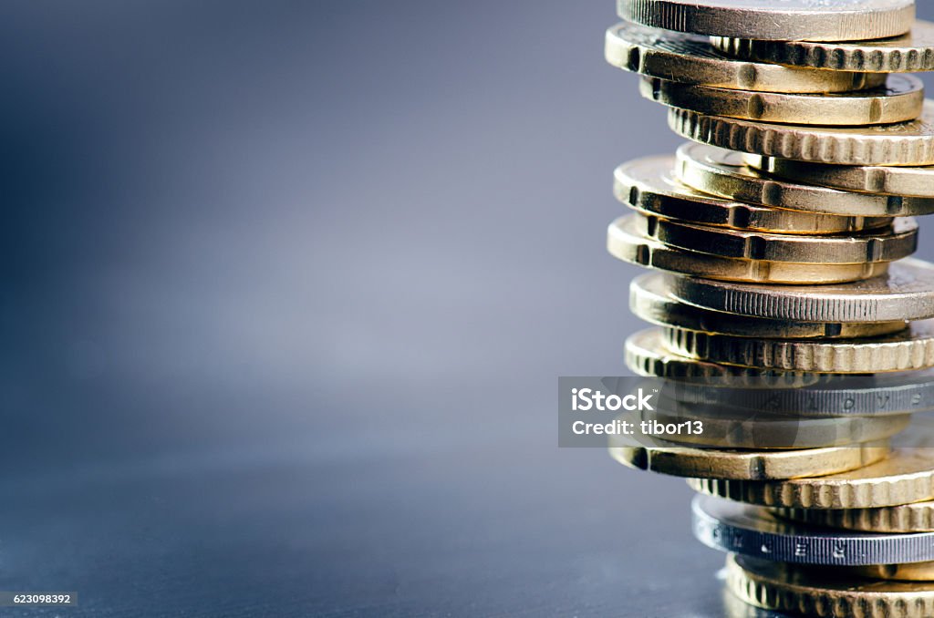 Euro money. Coins are isolated on a dark background. Euro money. Coins are isolated on a dark background. Currency of Europe. Balance of money. Building from coins. European Union Currency Stock Photo