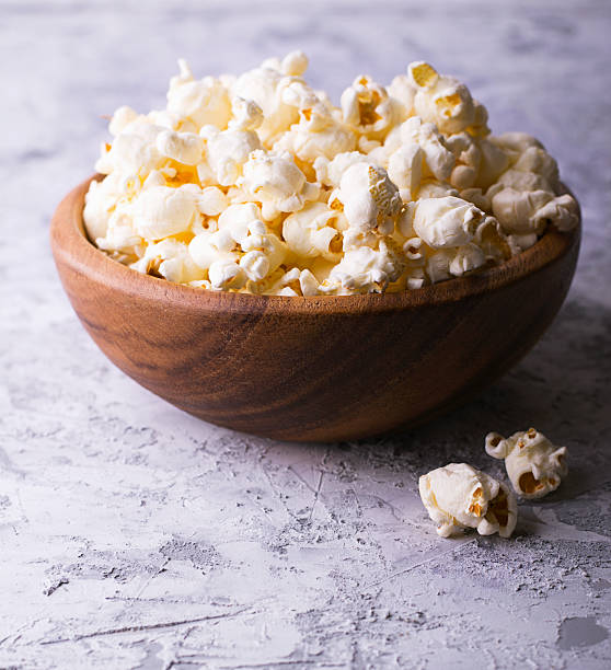 istock Popcorn in a bowl on wooden surface 623099916