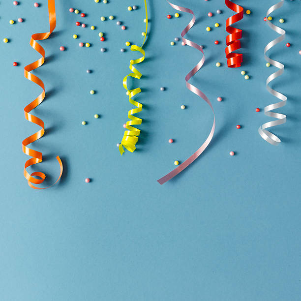 istock Colorul party streamers on blue background. Celebration concept. 623102014