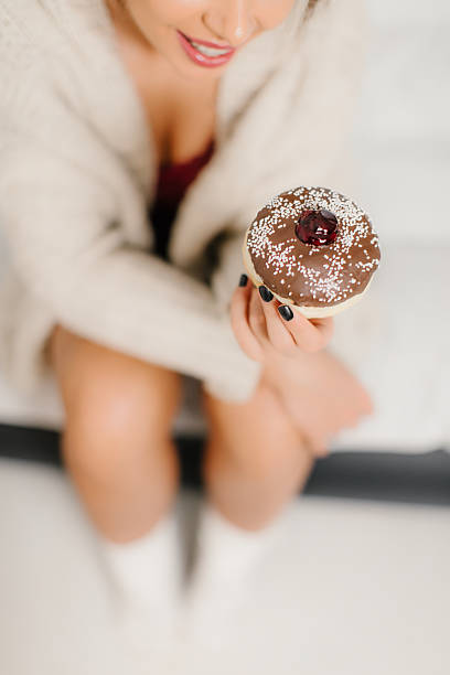 Eating donut in bed