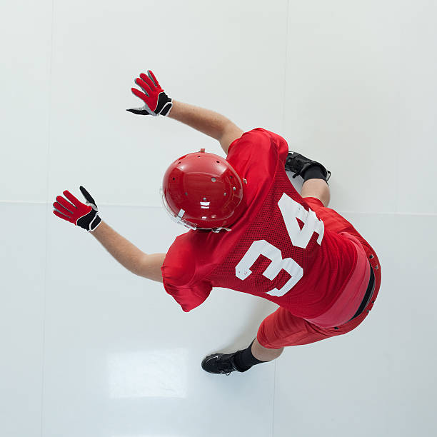 istock Above view of American football player blocking 623102500