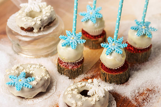 istock Lollypops side view on the snow and a few donuts 623102598