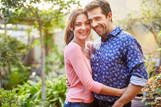 istock Handsome couple portrait in their garden. 623102890