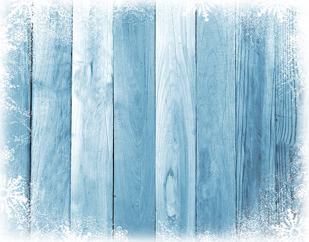 istock Old wooden board with snow flakes . Christmas background 623102904