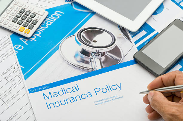 istock Health Insurance Policy brochure with paperwork 623104530