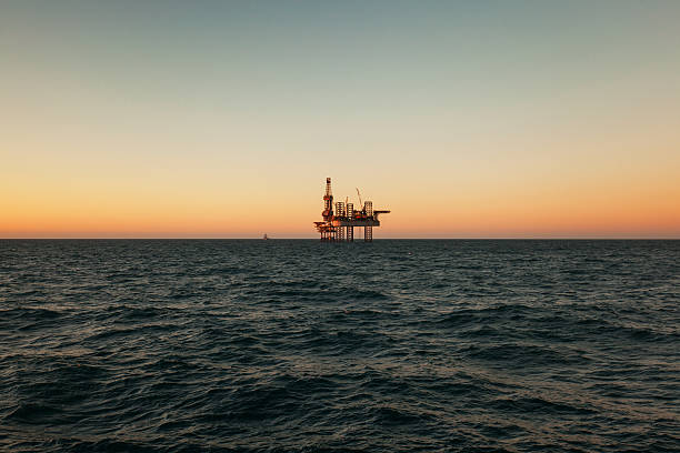 istock Offshore Jack Up Rig in The Middle  Sea at Sunset 623104728