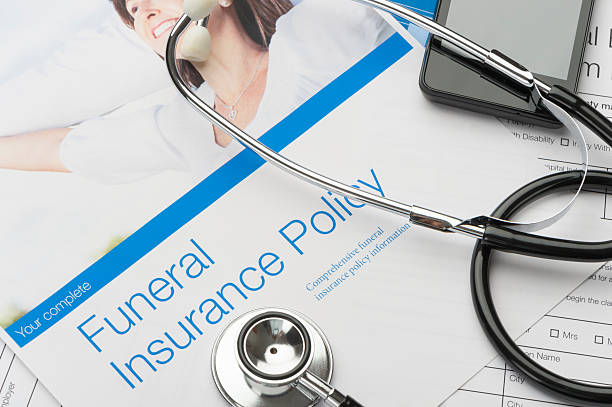istock Close up of a funeral insurance policy with stethoscope. 623105026