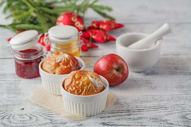 istock Baked apples on wooden table 623105474