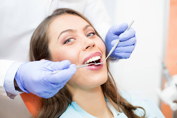 istock Young woman at dentist 623106088