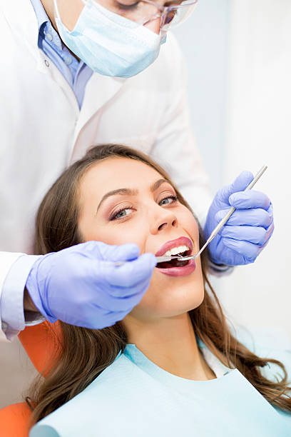 istock Young woman at dentist 623106096