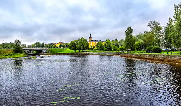 View on the Oulu Cathedral (Oulun tuomiokirkko) and Pokkisenvayla Bridge over Oulujoki river in Oulu.