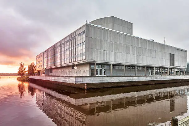 Oulu City Theatre is located on Vanmanninsaari island in Oulu River. Since the theatre is somewhat larger than the island, part of it is built out over the water.