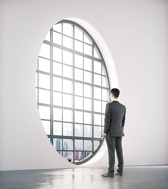 istock Businessman looking out of window 623106992