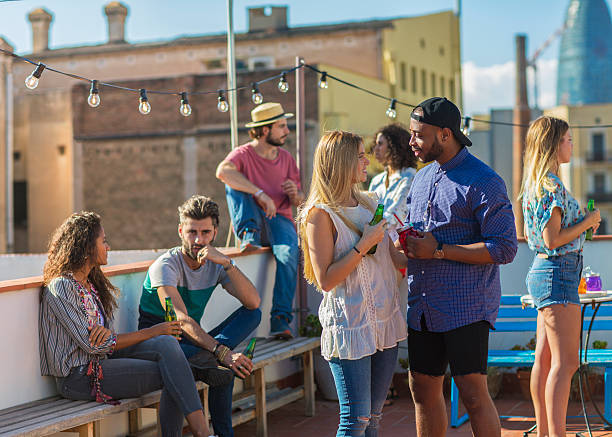 istock Group of friends partying on rooftop terrace 623108540