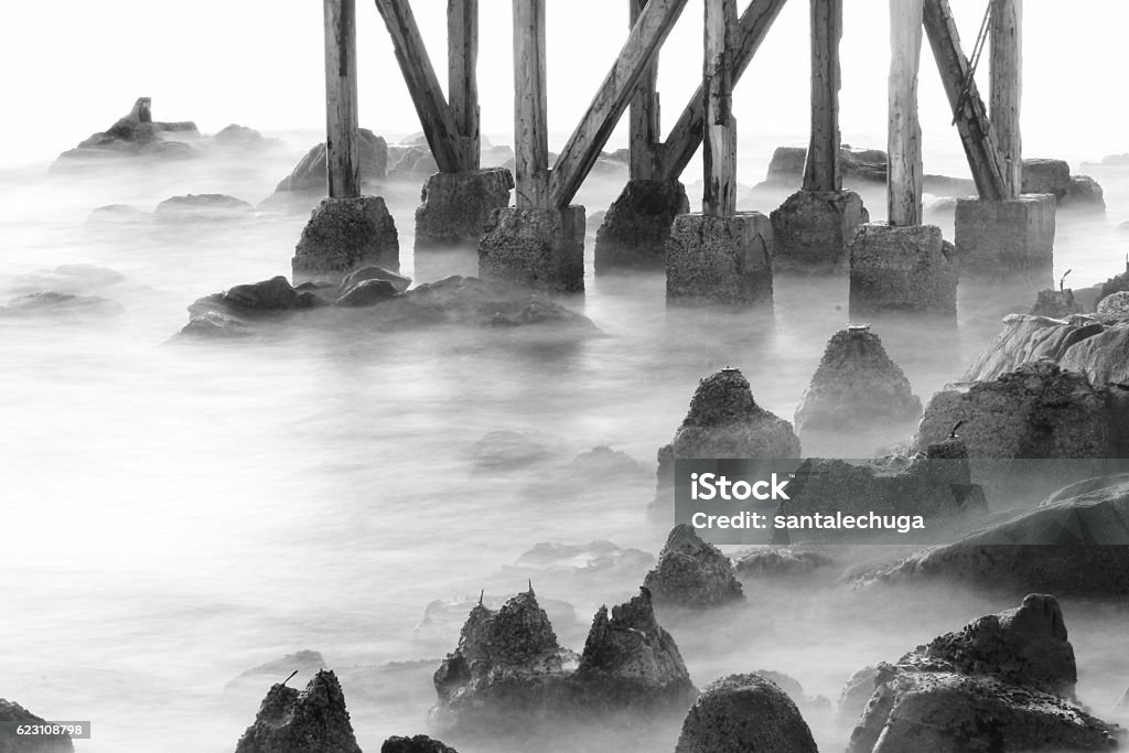 Ghost Rocks Pier footings and rocks off Cannery Row in Monterey, California Cannery Row Stock Photo