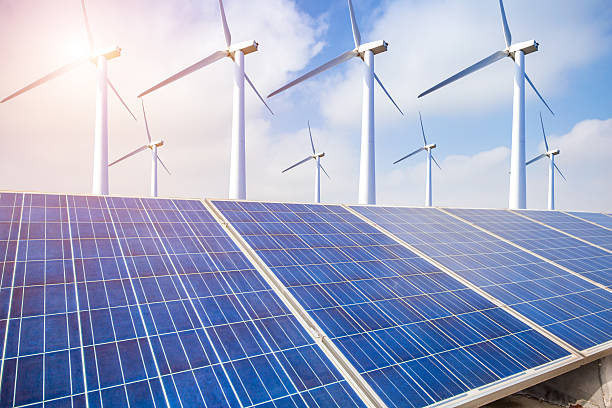 istock solar energy panels and wind turbine 623109490