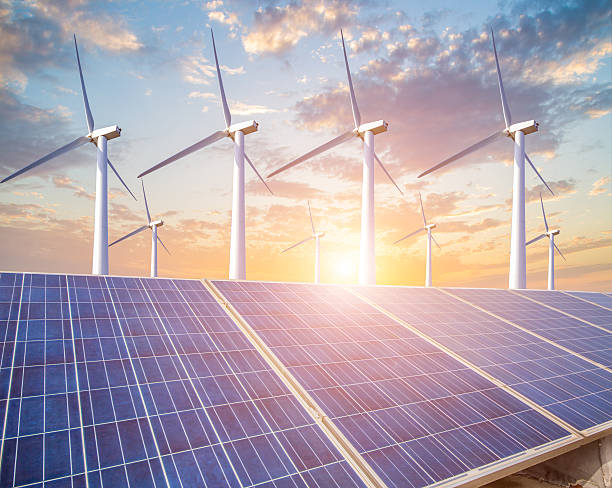 istock solar energy panels and wind turbine 623109604