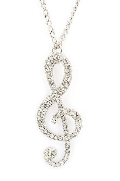 istock Pendant with a treble clef isolated on white 623110542