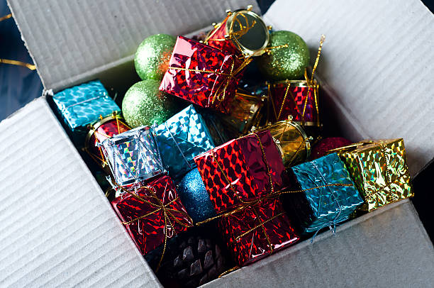 istock Collection of various Christmas decorations, placed into cardboard box 623111152