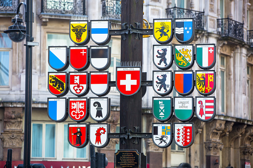 London, UK - October 4, 2015: Coats of Arms of Switzerland and its 26 national cantons, in Leicester Square, London.