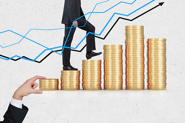istock Man climbing stacks of coins 623114118