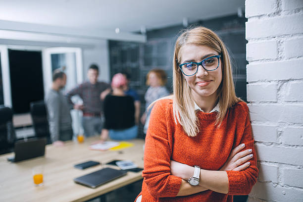 photo of young business woman in a conference room - speech recruitment technology young adult imagens e fotografias de stock