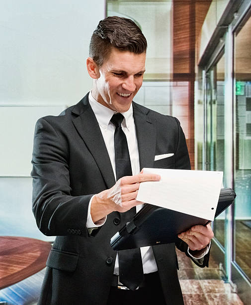 istock Smiling businessman working in office 623116750