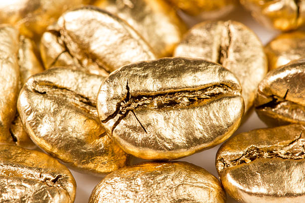 Gold coffee beans stock photo