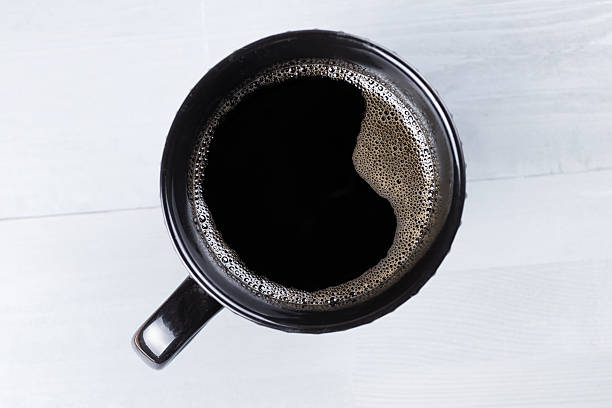 istock Black modern cup of coffee on grey natural wooden background. 623118212