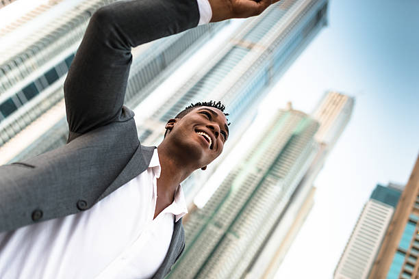 istock Successful business man against the skyscraper 623118976