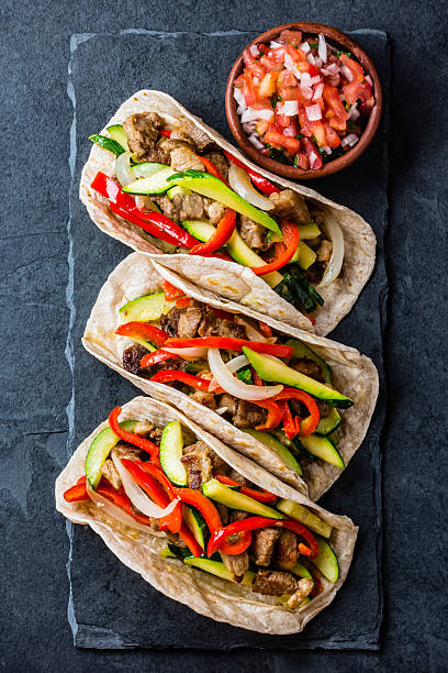 istock Mexican pork tacos with vegetables. Top view 623119950