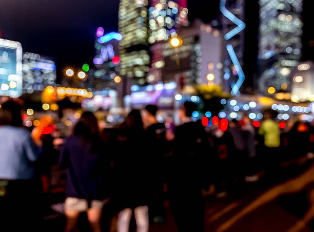 istock Abstract bokeh background of people at night 623120282