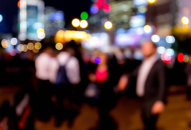 istock Abstract bokeh background of people at night 623120336