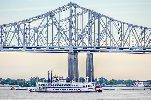 New Orleans, USA - November 11, 2016: The Crescent City Connection (CCC), formerly the Greater New Orleans Bridge (GNO), refers to twin cantilever bridges that carry U.S. Route 90 Business over the Mississippi River in New Orleans, Louisiana, United States. They are tied as the fifth-longest cantilever bridges in the world. Each span carries four general-use automobile lanes; additionally the westbound span has two reversible HOV lanes across the river.