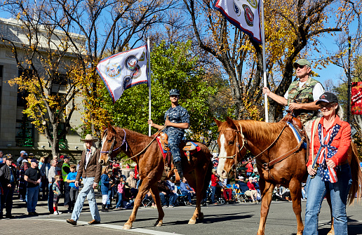 Prescott, AZ, USA - November 10, 2016: Veterans on horseback at the Veterans Day Parade in Prescott, Arizona, USA.