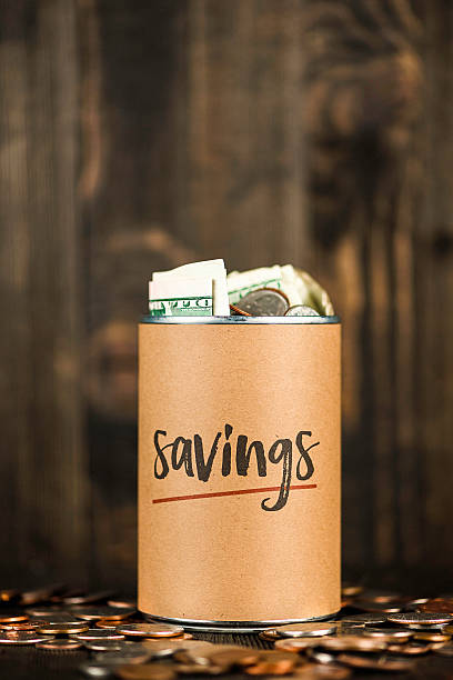 istock Savings can filled with American currency 623124812