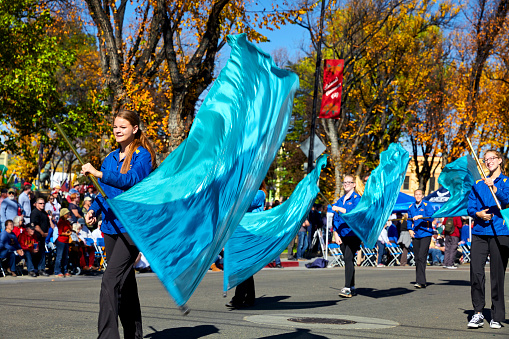 Prescott, AZ, USA - November 10, 2016: Young women waving flag batons at the Veterans Day Parade in Prescott, Arizona, USA.
