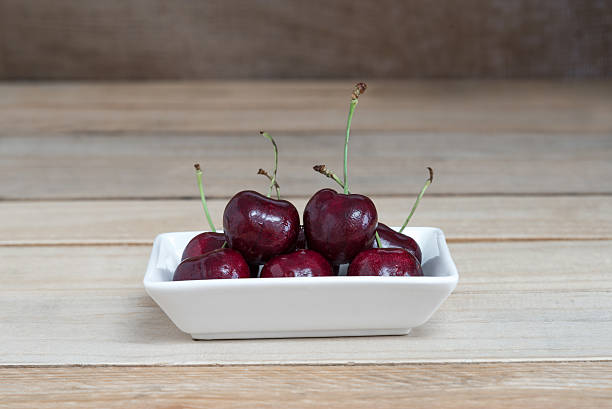 Sweet fresh cherry on wooden