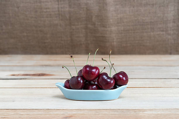 istock Sweet fresh cherry on wooden 623127496