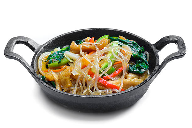 istock Korean rice noodle with vegetables on frying pan 623127558