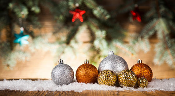 Merry Christmas, balls on wooden background